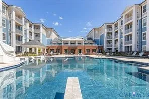 a large body of water next to a building