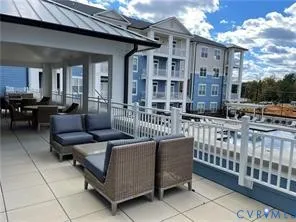 a outdoor living space with patio furniture and a potted plant