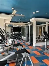 a room with lots of gym equipment and shower