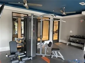 a room with gym equipment and a large window