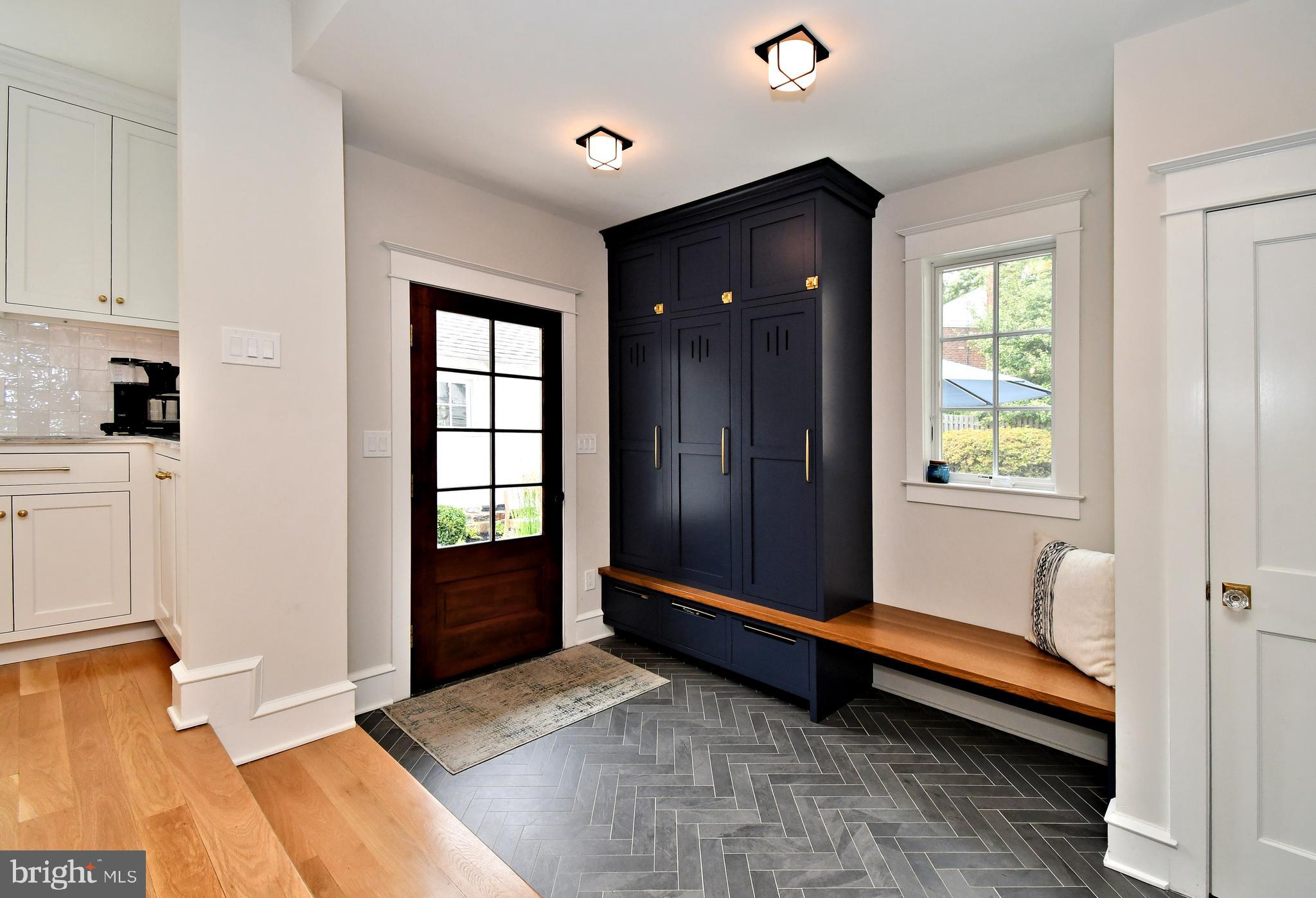 19 Croton Road Wayne, PA 19087 - Photo 17 of 64 Herringbone tiled Mud Room with window seat