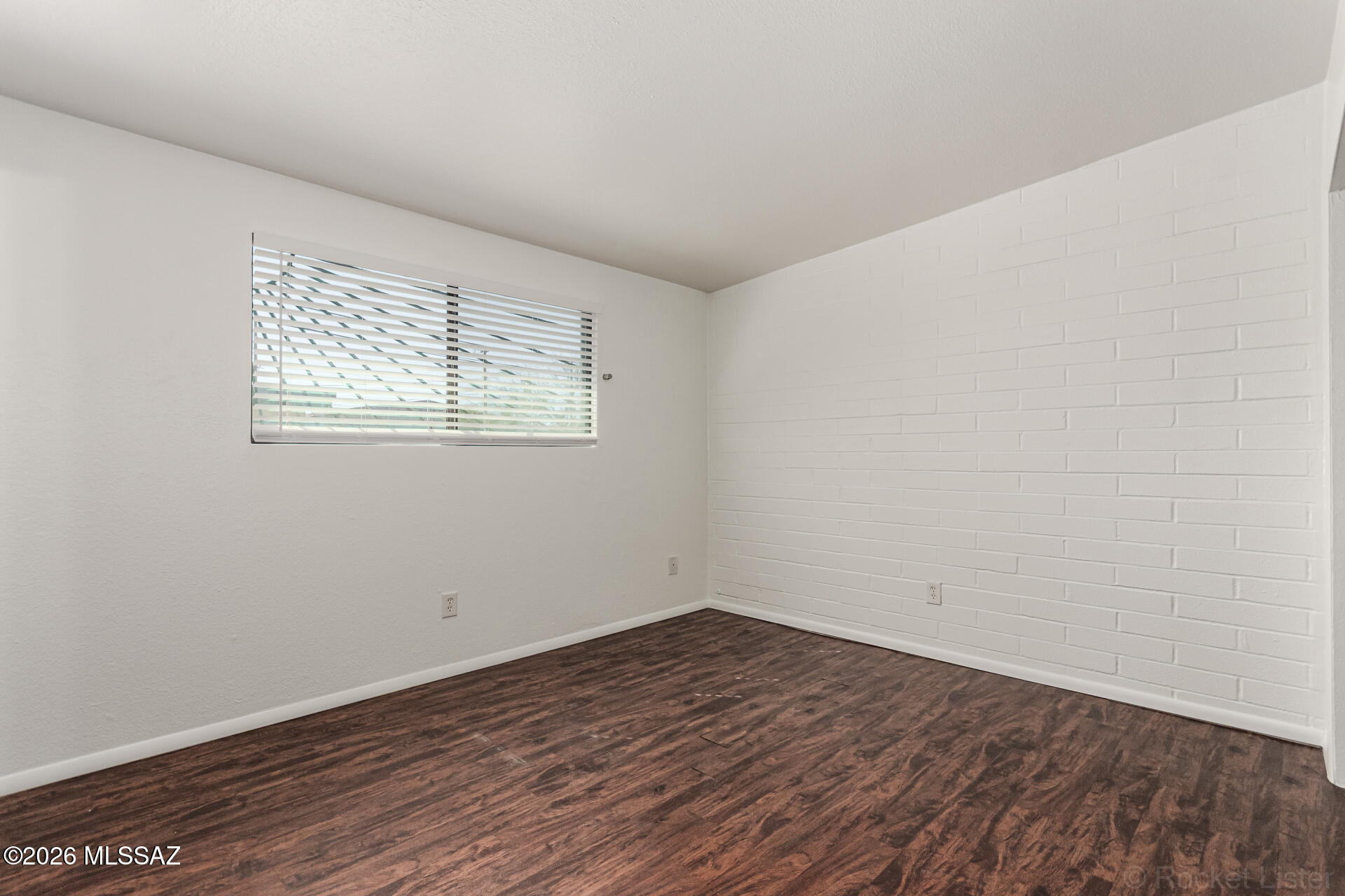 17 East Los Reales Road Tucson, AZ 85756 - Photo 11 of 27 an empty room with wooden floor and windows