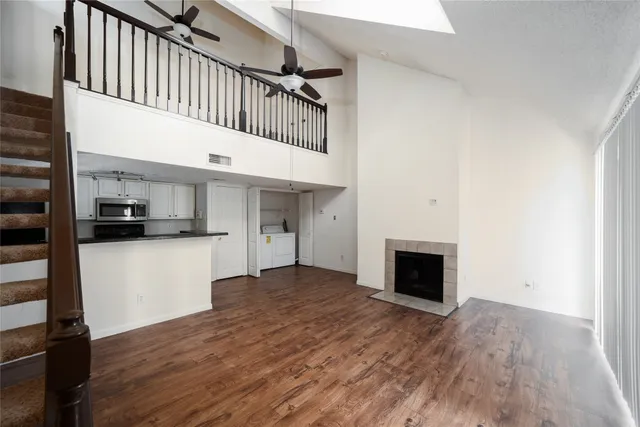 a view of an entryway with wooden floor