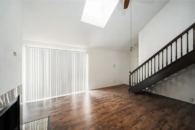 a kitchen with granite countertop a sink and stainless steel appliances