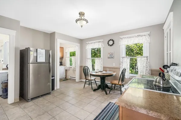 a view of a dining room with furniture window and outside view