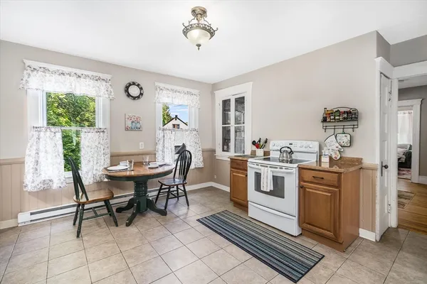 a view of a dining room with furniture window and outside view