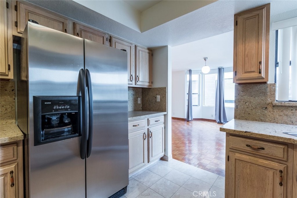 514 North Isabel Street, Unit C Glendale, CA 91206 - Photo 12 of 36 a kitchen with stainless steel appliances granite countertop a refrigerator and a stove top oven