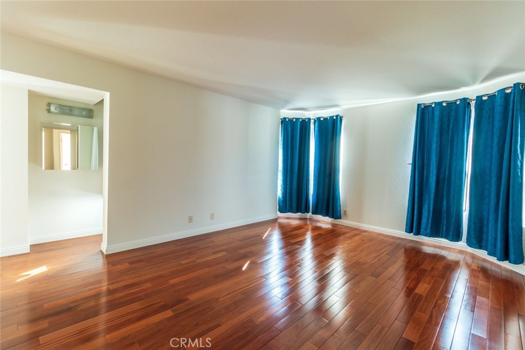 514 North Isabel Street, Unit C Glendale, CA 91206 - Photo 20 of 36 a view of an empty room with wooden floor