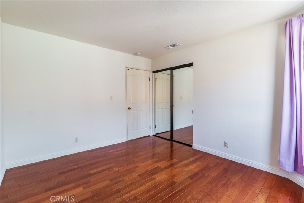 514 North Isabel Street, Unit C Glendale, CA 91206 - Photo 25 of 36 a view of empty room with wooden floor