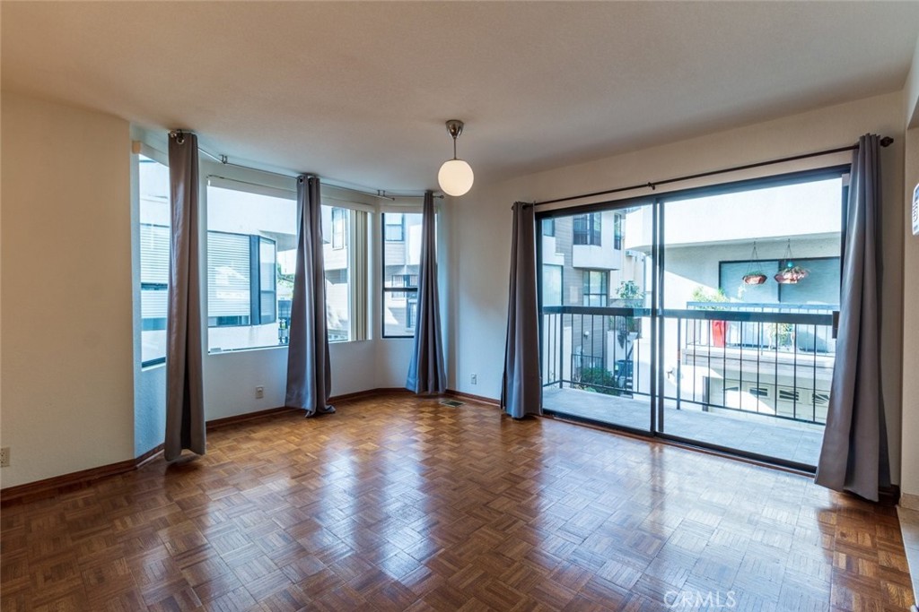514 North Isabel Street, Unit C Glendale, CA 91206 - Photo 10 of 36 wooden floor in an empty room with a window