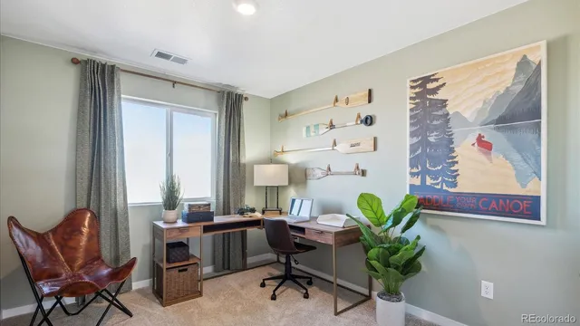 a workspace with furniture and a window