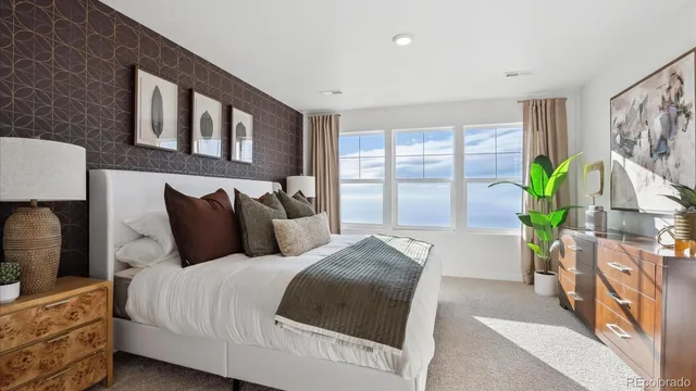 a bedroom with bed and window