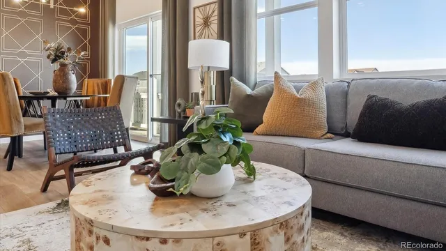 a dining room with furniture and wooden floor