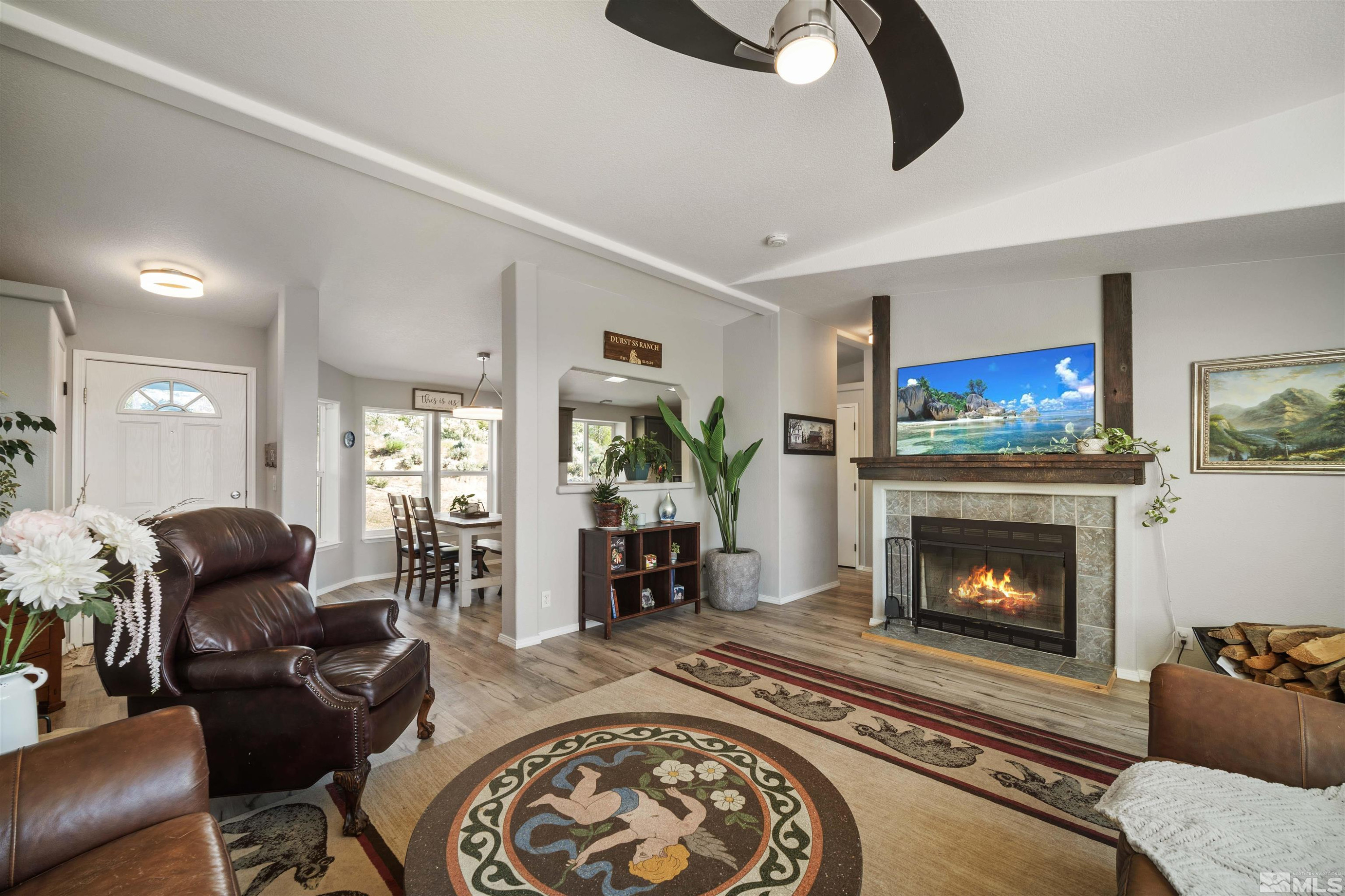 13705 North Red Rock Road Reno, NV 89508 - Photo 11 of 46 a living room with furniture and a fireplace