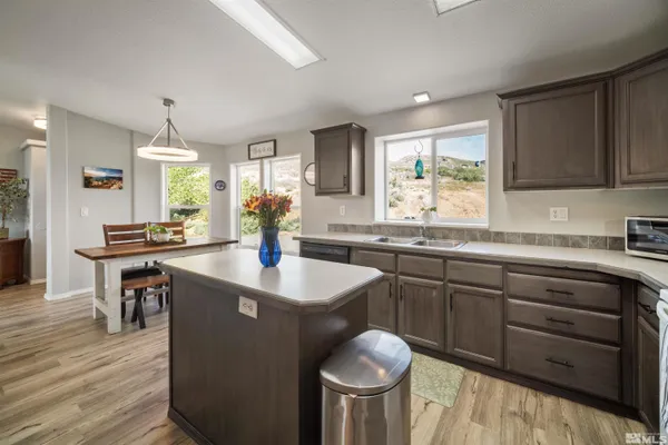 a kitchen with sink and cabinets