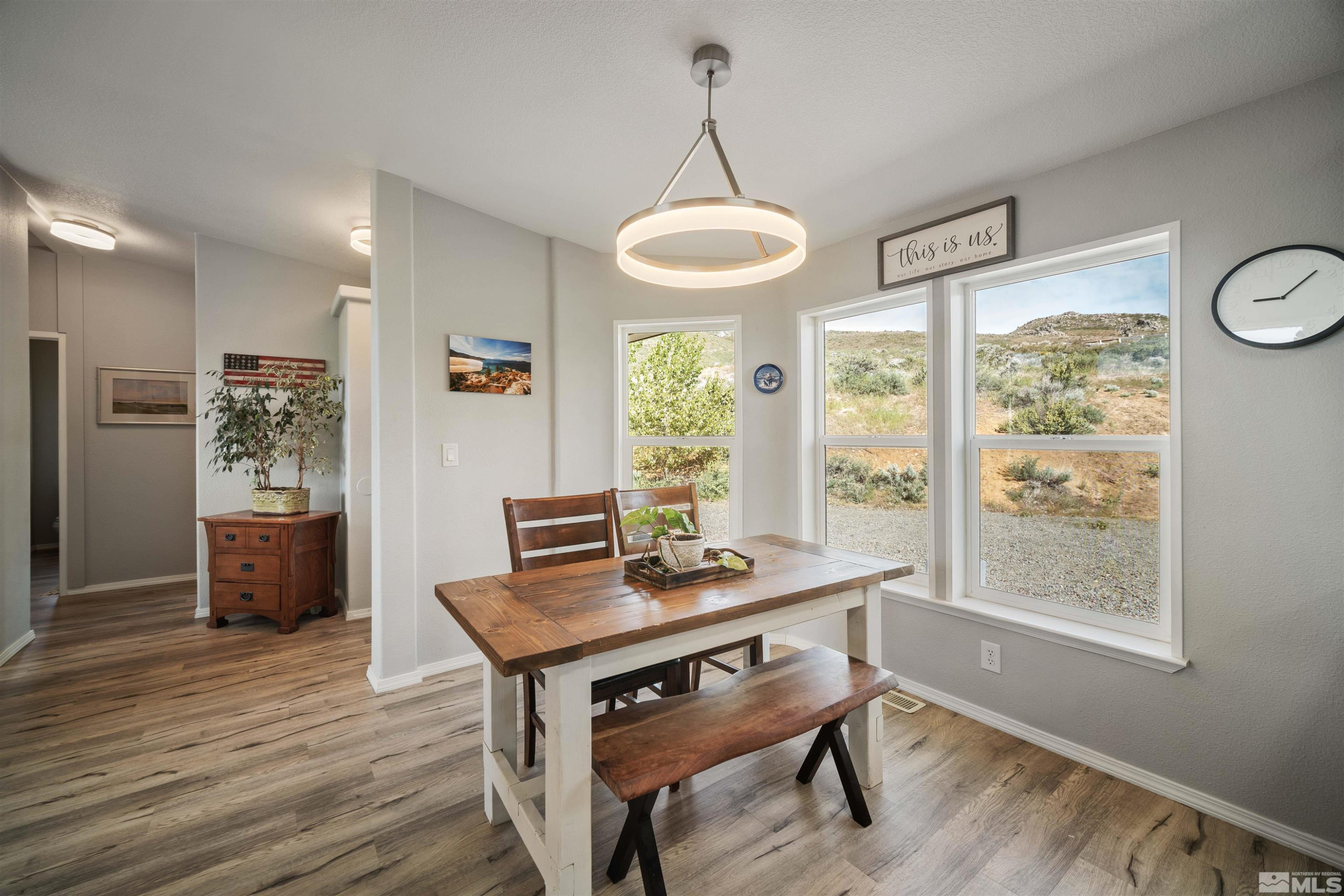 13705 North Red Rock Road Reno, NV 89508 - Photo 18 of 46 a view of a dining room with furniture window and wooden floor