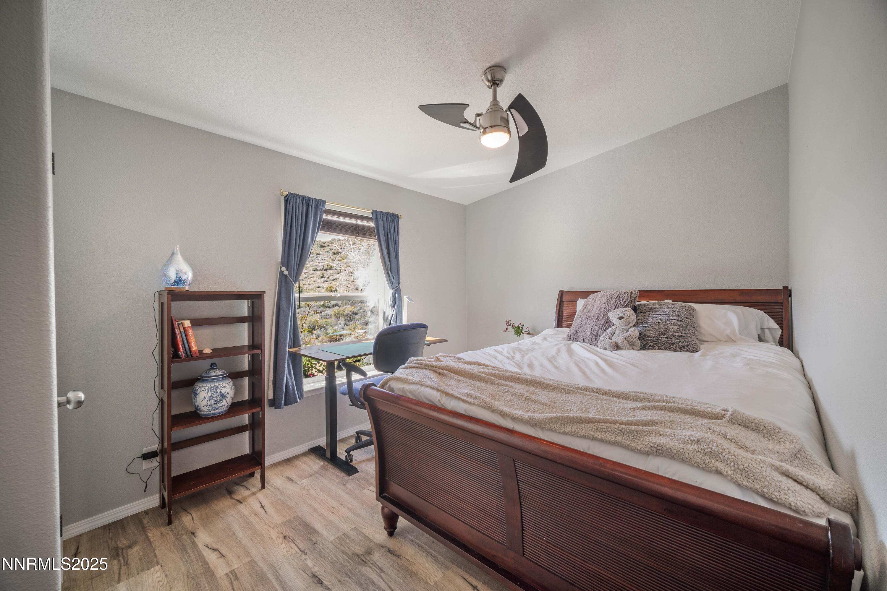 13705 North Red Rock Road Reno, NV 89508 - Photo 29 of 46 a bedroom with a bed and a window