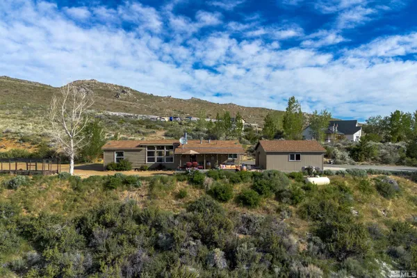 a view of a town with mountains in the background