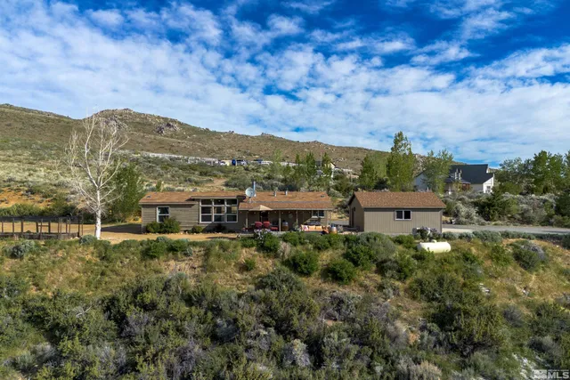 a view of a town with mountains in the background