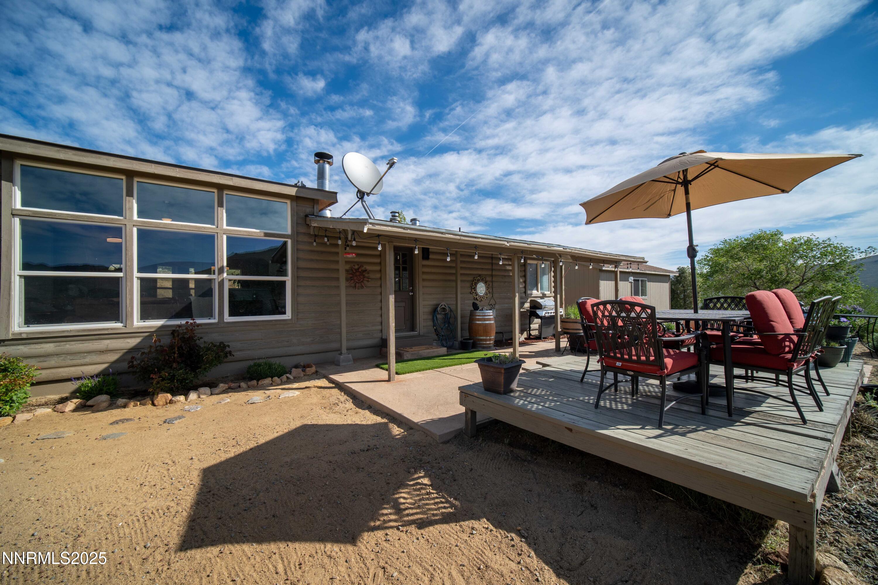 13705 North Red Rock Road Reno, NV 89508 - Photo 42 of 46 a view of a backyard with a patio and outdoor seating