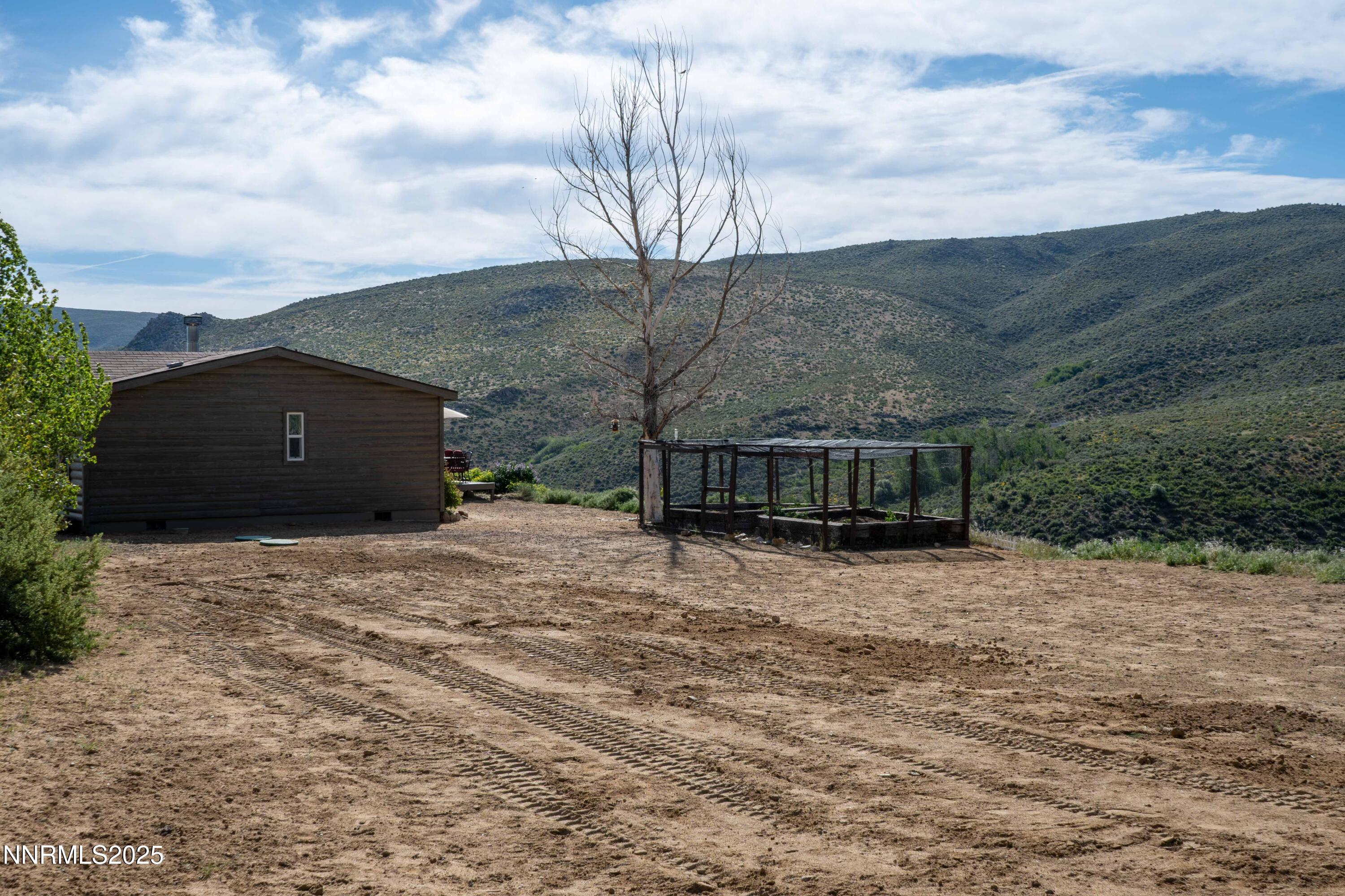 13705 North Red Rock Road Reno, NV 89508 - Photo 43 of 46 a view of a house with a yard