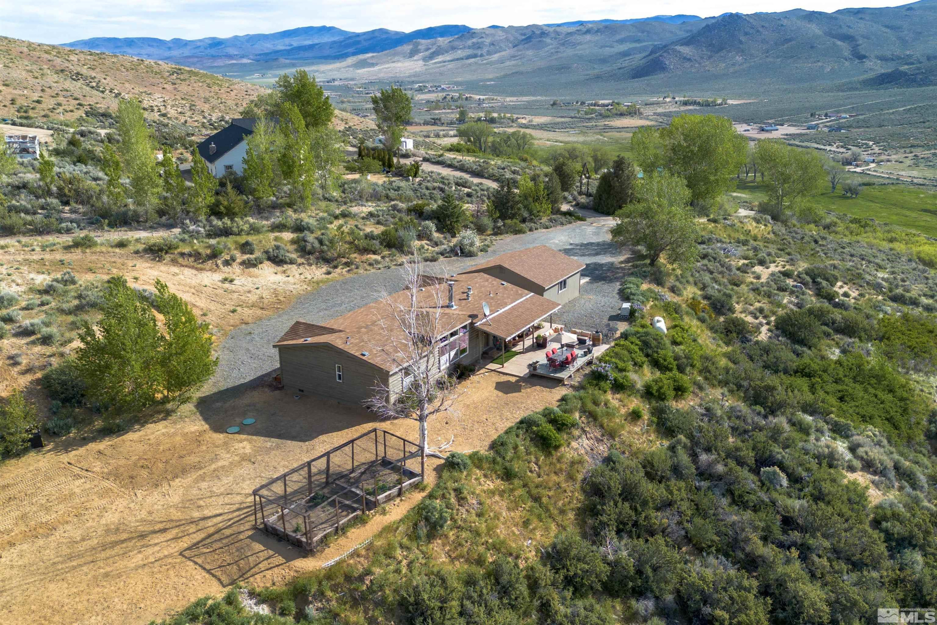 13705 North Red Rock Road Reno, NV 89508 - Photo 5 of 46 an aerial view of residential houses with outdoor space and trees