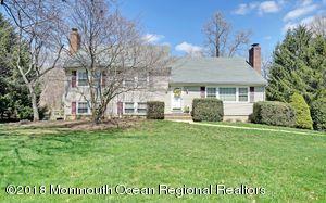 18 Dale Road Middletown, NJ 07748 - Photo 1 of 48 a front view of a house with a garden