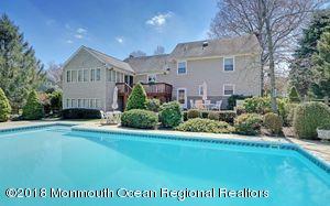 18 Dale Road Middletown, NJ 07748 - Photo 2 of 48 a front view of a house with a garden
