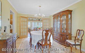 18 Dale Road Middletown, NJ 07748 - Photo 12 of 48 a view of a dining room with furniture window and outside view
