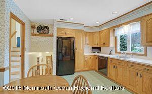 18 Dale Road Middletown, NJ 07748 - Photo 15 of 48 a open kitchen with stainless steel appliances granite countertop a refrigerator a stove and a sink with cabinets