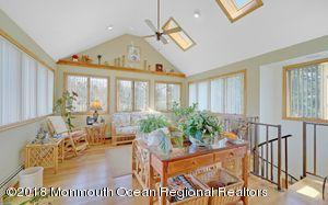 18 Dale Road Middletown, NJ 07748 - Photo 17 of 48 a living room with furniture and a large window