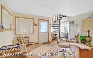 18 Dale Road Middletown, NJ 07748 - Photo 18 of 48 a view of a livingroom with furniture and staircase
