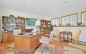 18 Dale Road Middletown, NJ 07748 - Photo 19 of 48 a work place with furniture and a book shelf