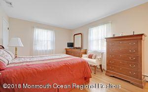 18 Dale Road Middletown, NJ 07748 - Photo 20 of 48 a bedroom with a bed and a dresser