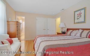 18 Dale Road Middletown, NJ 07748 - Photo 21 of 48 a bedroom with a bed and a couch