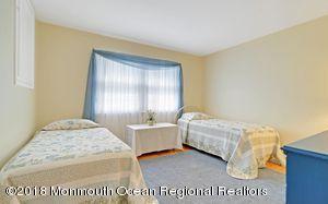 18 Dale Road Middletown, NJ 07748 - Photo 22 of 48 a bedroom with a bed and a window