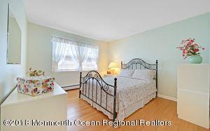 18 Dale Road Middletown, NJ 07748 - Photo 23 of 48 a bedroom with a bed and a window
