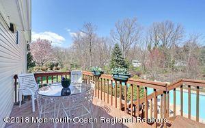 18 Dale Road Middletown, NJ 07748 - Photo 31 of 48 a view of a chairs and table on the terrace