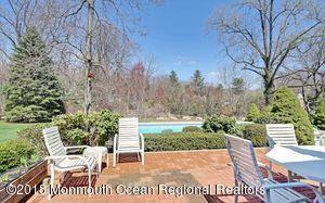 18 Dale Road Middletown, NJ 07748 - Photo 33 of 48 a view of a patio with a table and chairs and potted plants