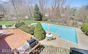 18 Dale Road Middletown, NJ 07748 - Photo 34 of 48 a view of a swimming pool with a yard and sitting area