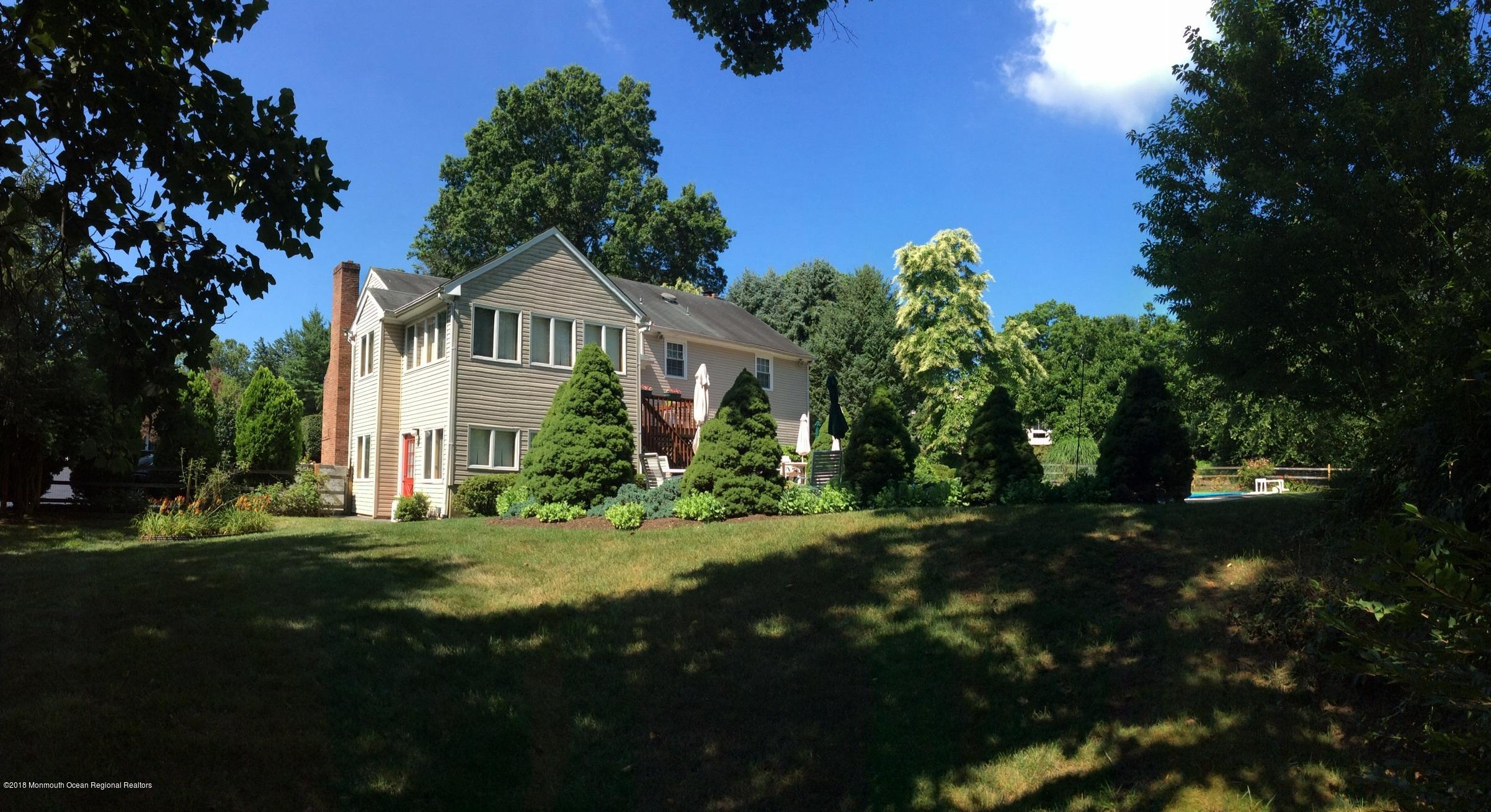 18 Dale Road Middletown, NJ 07748 - Photo 38 of 48 a front view of a house with a garden