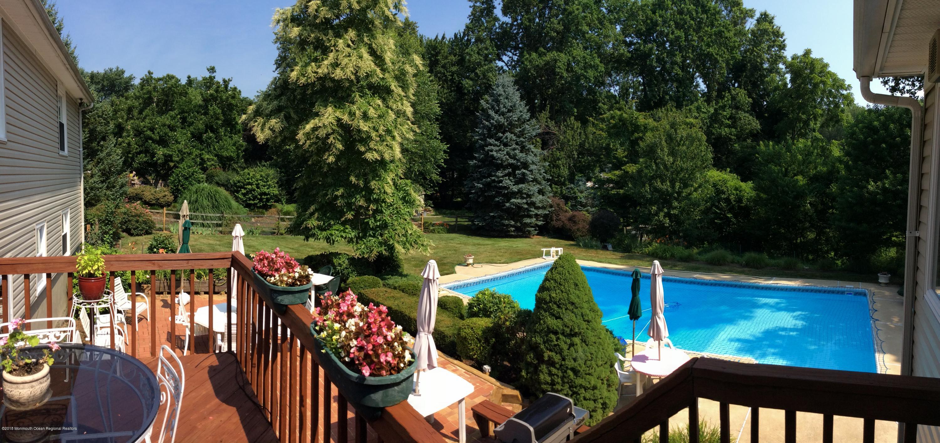18 Dale Road Middletown, NJ 07748 - Photo 41 of 48 an outdoor view of the patio and swimming pool