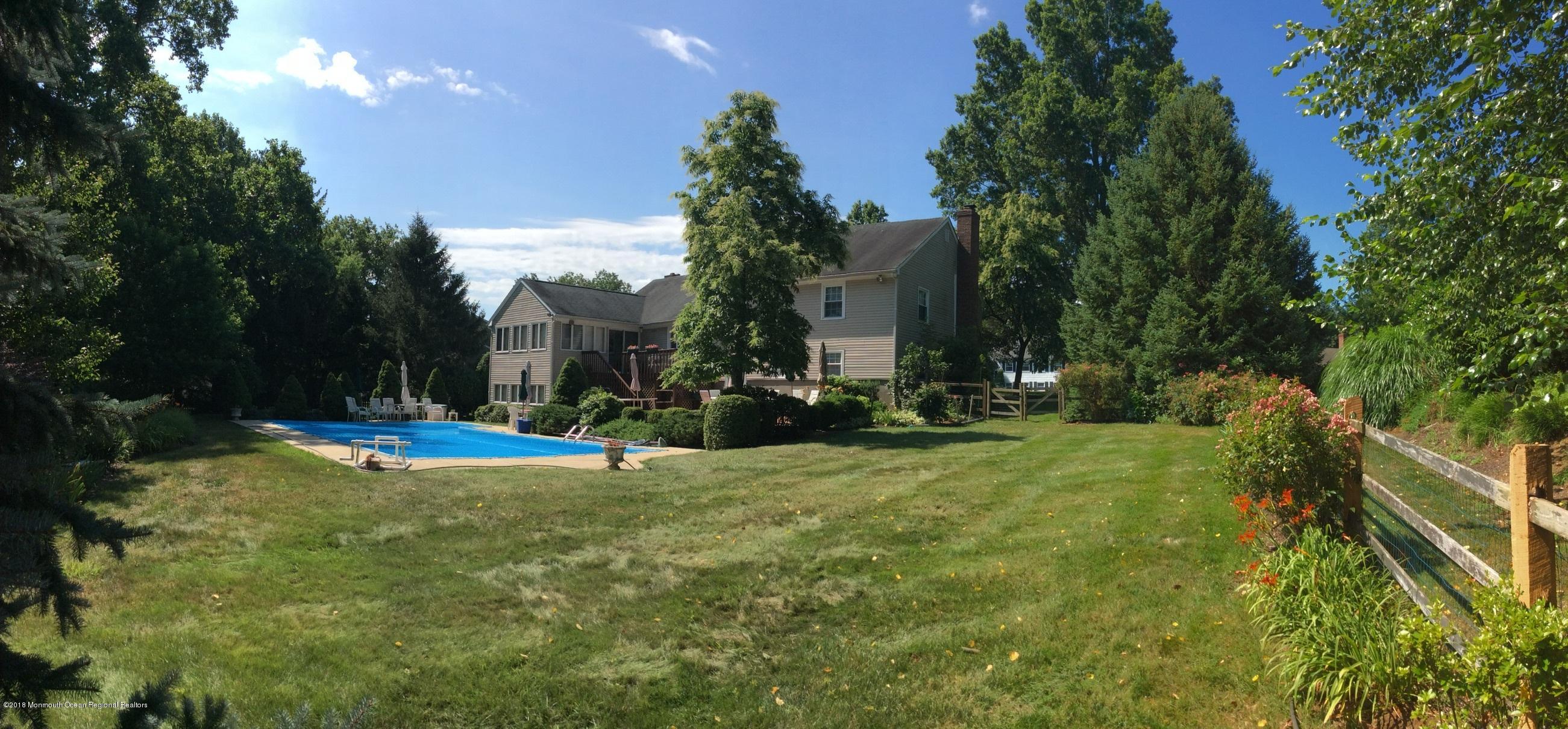 18 Dale Road Middletown, NJ 07748 - Photo 45 of 48 a view of a fountain in front of the house