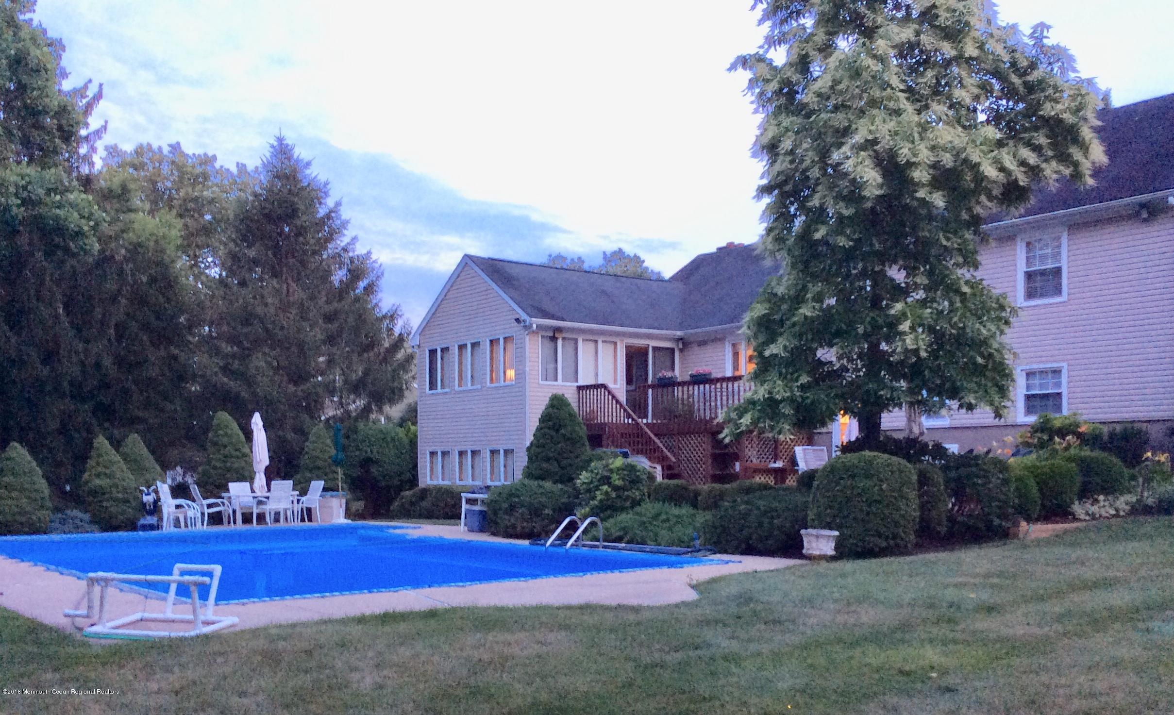 18 Dale Road Middletown, NJ 07748 - Photo 48 of 48 a view of a house with outdoor space and garden