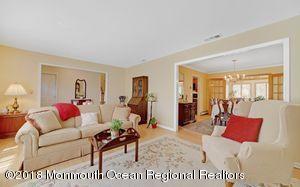 18 Dale Road Middletown, NJ 07748 - Photo 9 of 48 a living room with furniture a rug and a table