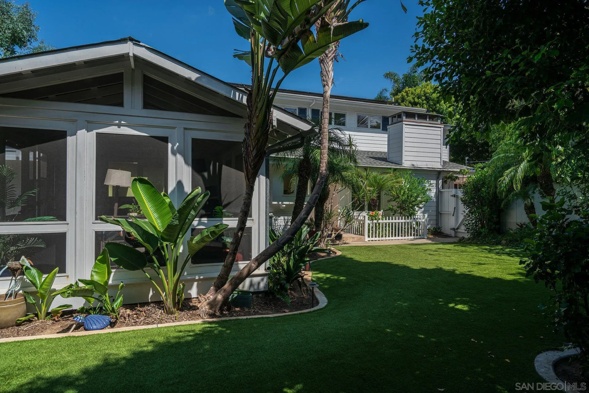 684 Arden Drive Encinitas, CA 92024 - Photo 12 of 59 a view of a house with a yard and a tree