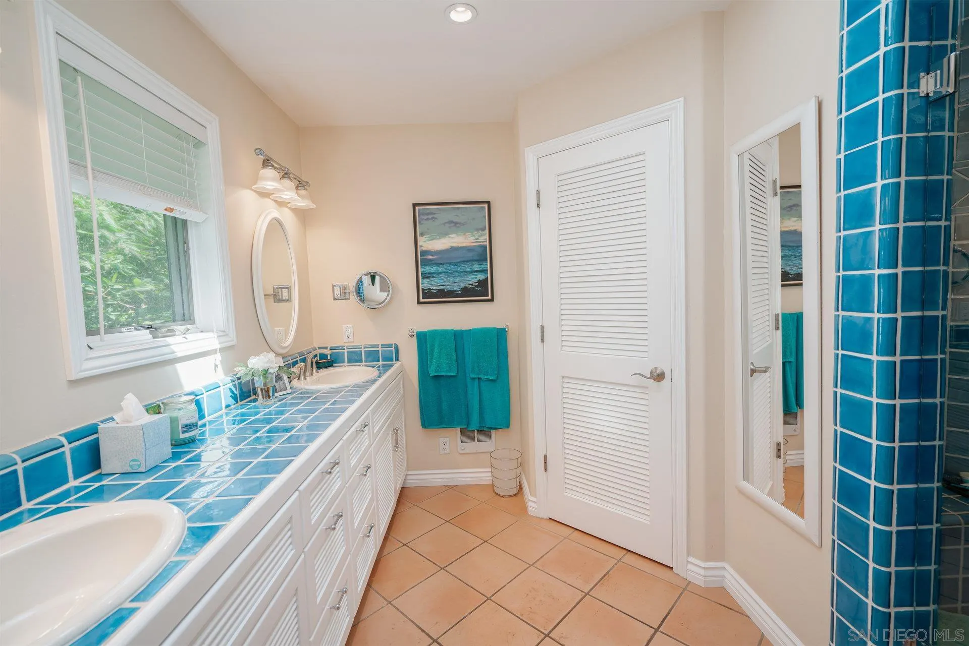 684 Arden Drive Encinitas, CA 92024 - Photo 36 of 59 a spacious bathroom with a granite countertop tub sink a mirror a shower and vanity