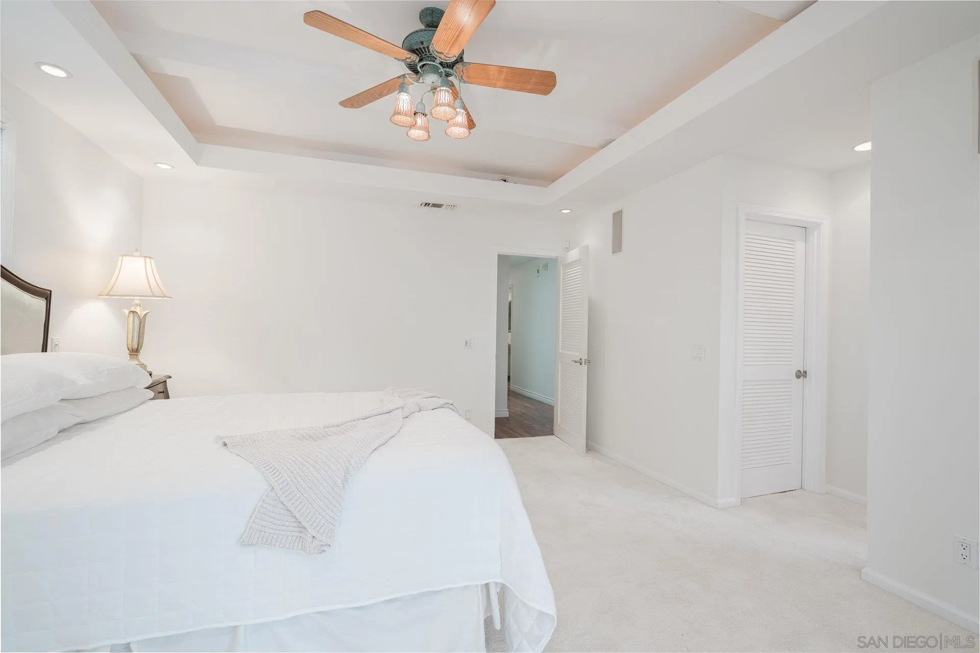 684 Arden Drive Encinitas, CA 92024 - Photo 37 of 59 a bedroom with a bed and a chandelier