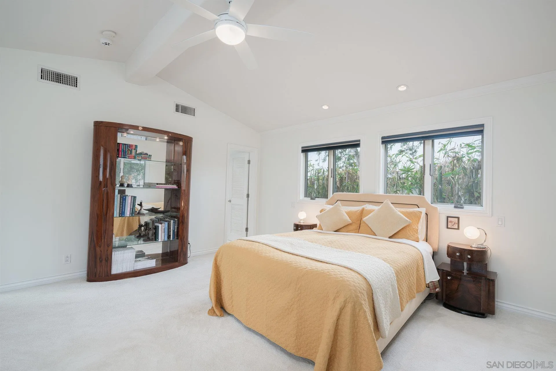 684 Arden Drive Encinitas, CA 92024 - Photo 41 of 59 a bedroom with a large bed and a large window