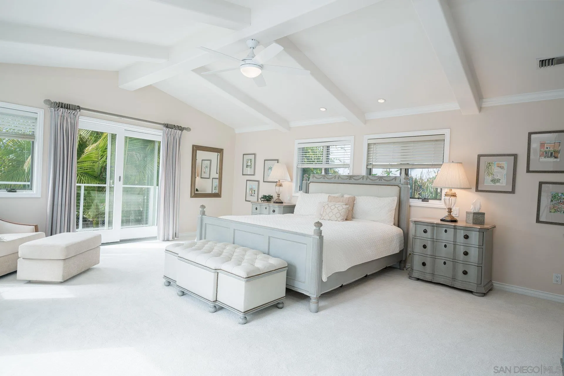 684 Arden Drive Encinitas, CA 92024 - Photo 46 of 59 a spacious bedroom with a bed and a large window